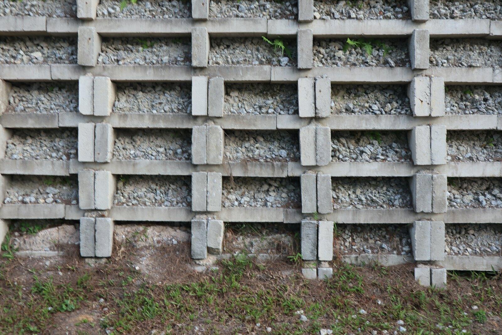 Stacked concrete block retaining wall